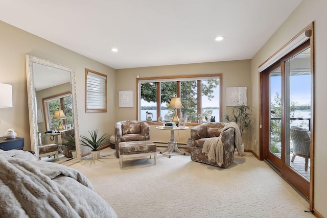 9525 Shore Trl N, Forest Lake, MN 55025 - living area featuring light carpet, recessed lighting, and a baseboard radiator