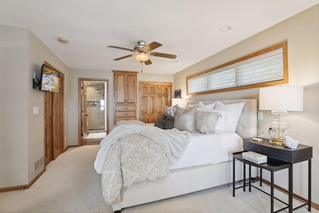 9525 Shore Trl N, Forest Lake, MN 55025 - bedroom featuring light carpet, ensuite bathroom, and a ceiling fan