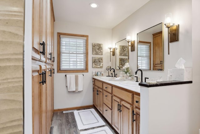 9525 Shore Trl N, Forest Lake, MN 55025 - full bath featuring double vanity, wood finished floors, plenty of natural light, and recessed lighting