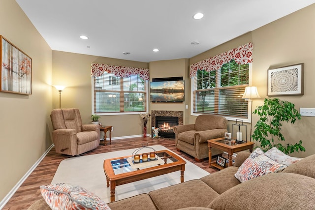 15618 Emerald Dr N Unit 2, Hugo, MN 55038 - living room featuring a glass covered fireplace, wood finished floors, and recessed lighting