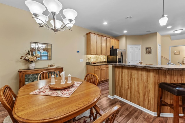 15618 Emerald Dr N Unit 2, Hugo, MN 55038 - dining room featuring dark wood-type flooring, recessed lighting, and a chandelier