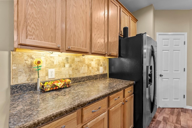 15618 Emerald Dr N Unit 2, Hugo, MN 55038 - kitchen with refrigerator with ice dispenser, dark countertops, tasteful backsplash, and wood finished floors