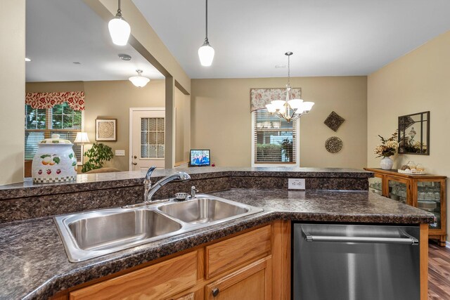 15618 Emerald Dr N Unit 2, Hugo, MN 55038 - kitchen with dishwasher, dark countertops, decorative light fixtures, a chandelier, and wood finished floors
