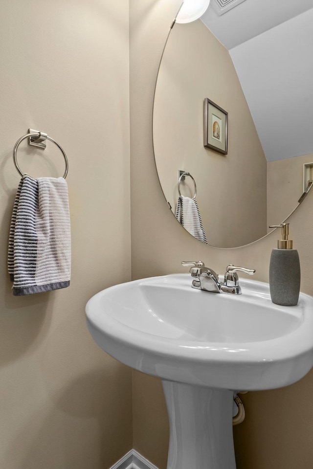 15618 Emerald Dr N Unit 2, Hugo, MN 55038 - bathroom with lofted ceiling and a sink