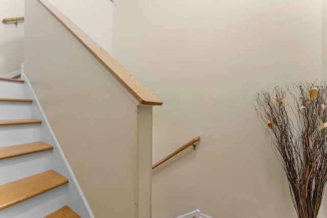 15618 Emerald Dr N Unit 2, Hugo, MN 55038 - stairs featuring wood finished floors and baseboards