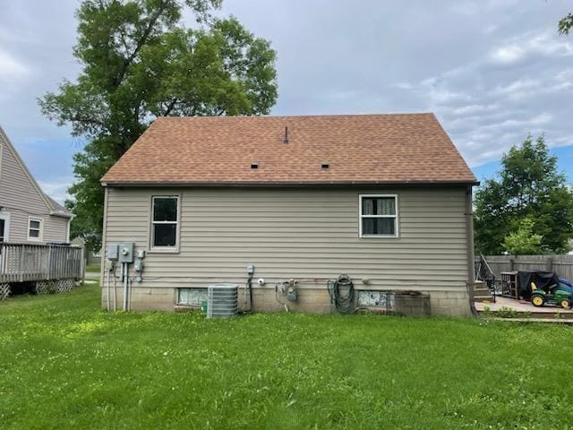 206 20th St S, Benson, MN 56215 - rear view of property featuring roof with shingles and a deck