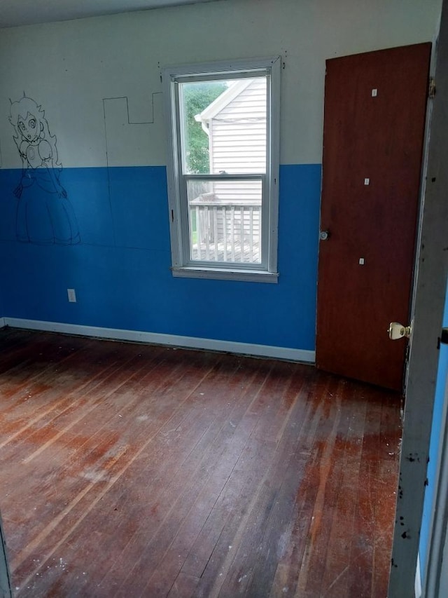 206 20th St S, Benson, MN 56215 - unfurnished room with hardwood / wood-style floors and baseboards