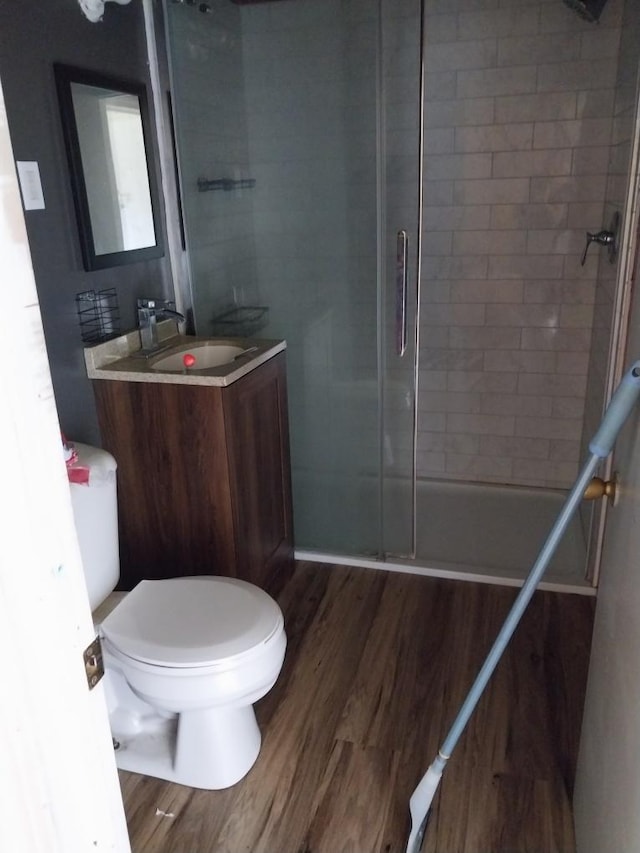 206 20th St S, Benson, MN 56215 - full bath with a tile shower, wood finished floors, and vanity