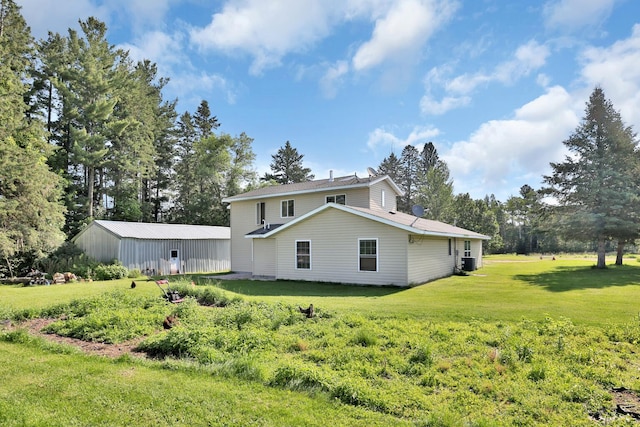 75309 Twin Oaks Rd, Bremen Twp, MN 55735 - rear view of property with a yard and view of wooded area