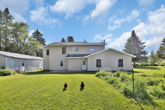 75309 Twin Oaks Rd, Bremen Twp, MN 55735 - rear view of property featuring a lawn and a patio area