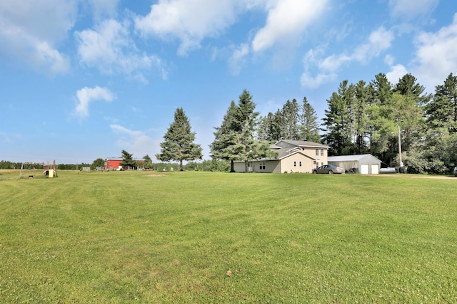 75309 Twin Oaks Rd, Bremen Twp, MN 55735 - view of green lawn featuring a detached garage