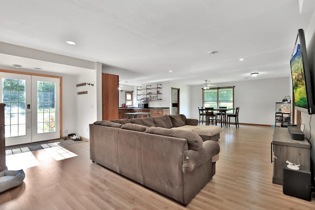 75309 Twin Oaks Rd, Bremen Twp, MN 55735 - living room featuring french doors, light wood finished floors, and recessed lighting