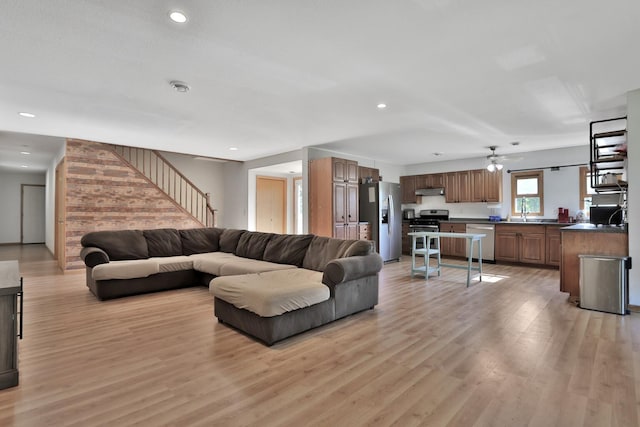 75309 Twin Oaks Rd, Bremen Twp, MN 55735 - living room with light wood-type flooring, ceiling fan, recessed lighting, and stairway