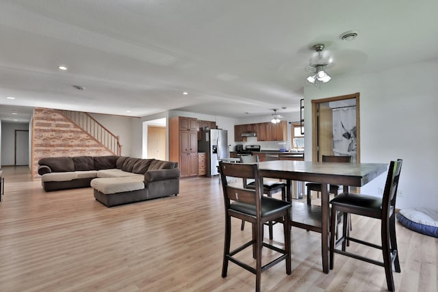 75309 Twin Oaks Rd, Bremen Twp, MN 55735 - dining space featuring a ceiling fan, stairway, light wood-style flooring, and recessed lighting
