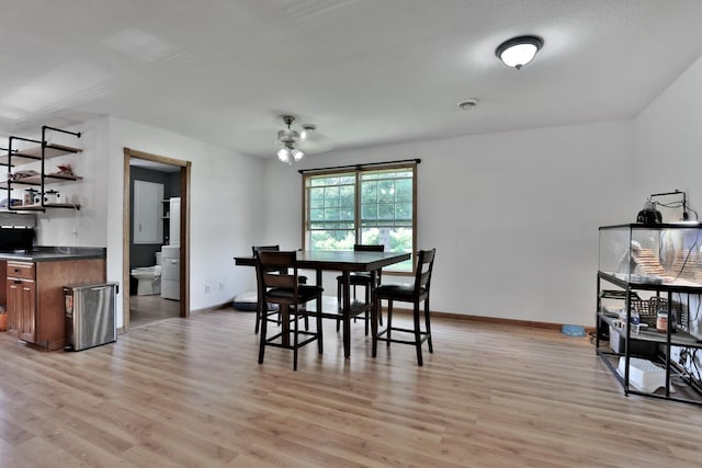 75309 Twin Oaks Rd, Bremen Twp, MN 55735 - dining space with light wood-type flooring and bar