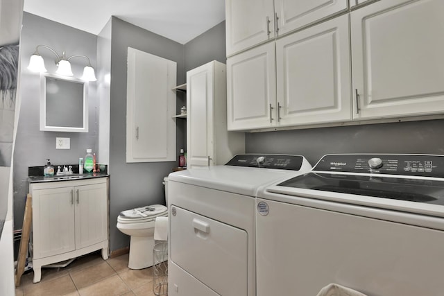 75309 Twin Oaks Rd, Bremen Twp, MN 55735 - laundry area with washing machine and clothes dryer and light tile patterned floors
