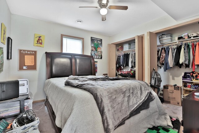 75309 Twin Oaks Rd, Bremen Twp, MN 55735 - bedroom with light carpet, multiple closets, and ceiling fan