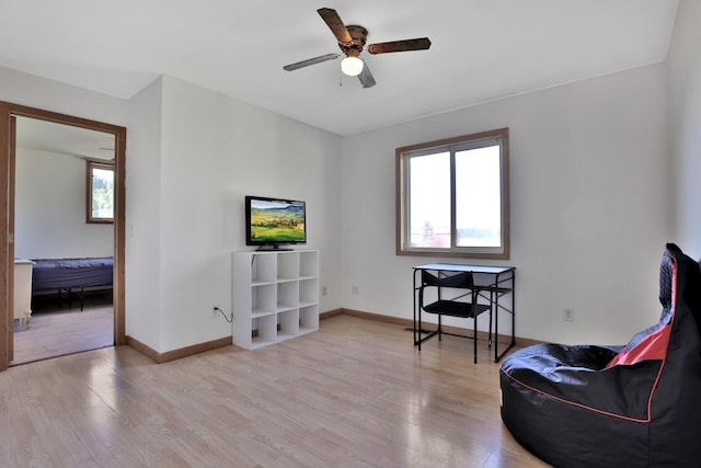 75309 Twin Oaks Rd, Bremen Twp, MN 55735 - living area featuring wood finished floors and a ceiling fan
