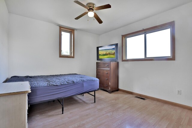 75309 Twin Oaks Rd, Bremen Twp, MN 55735 - bedroom featuring light wood finished floors and ceiling fan