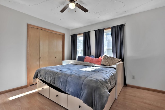75309 Twin Oaks Rd, Bremen Twp, MN 55735 - bedroom featuring light wood finished floors, a closet, and a ceiling fan