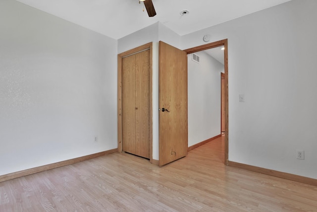 75309 Twin Oaks Rd, Bremen Twp, MN 55735 - unfurnished bedroom with light wood finished floors, a ceiling fan, and a closet