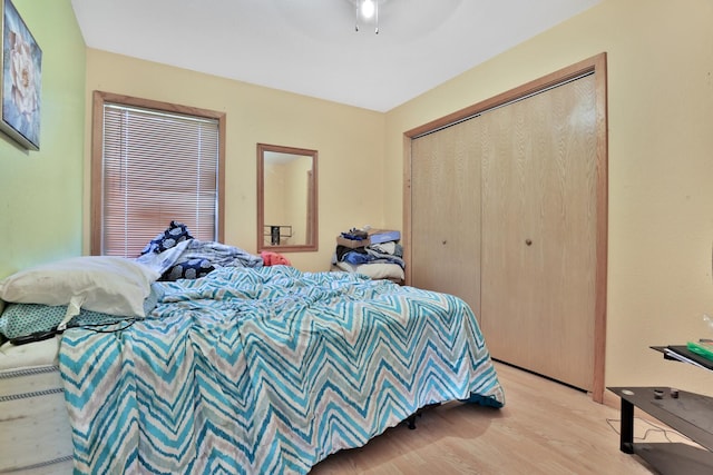 75309 Twin Oaks Rd, Bremen Twp, MN 55735 - bedroom featuring light wood-style floors, a closet, and ceiling fan
