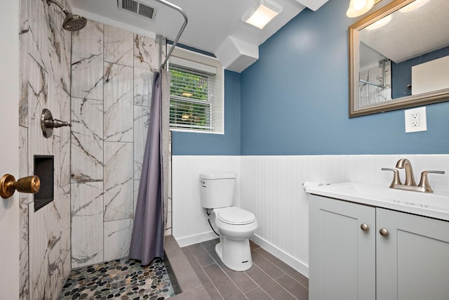 711 Quincy St NE, Minneapolis, MN 55413 - full bath with vanity, a marble finish shower, and wainscoting
