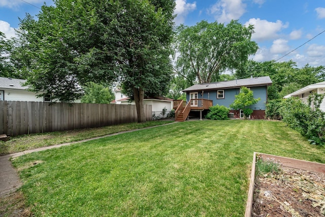 711 Quincy St NE, Minneapolis, MN 55413 - fenced yard featuring stairway and a deck
