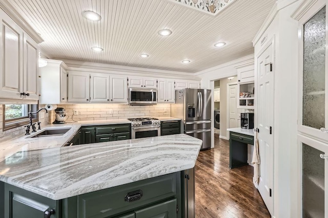 791 139th Ln NW, Andover, MN 55304 - kitchen featuring stainless steel appliances, decorative backsplash, washer / dryer, recessed lighting, and light stone counters