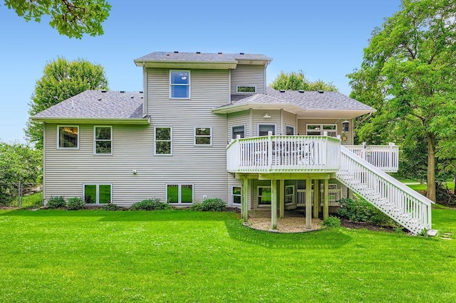 791 139th Ln NW, Andover, MN 55304 - back of house featuring a lawn, a wooden deck, a shingled roof, and stairway