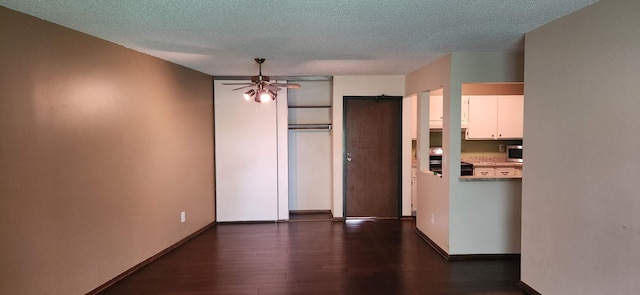 1855 Silver Bell Rd Unit 301, Eagan, MN 55122 - unfurnished bedroom with dark wood-style floors and a textured ceiling