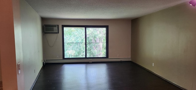 1855 Silver Bell Rd Unit 301, Eagan, MN 55122 - spare room featuring a textured ceiling, dark wood-style flooring, a wall unit AC, and a baseboard heating unit