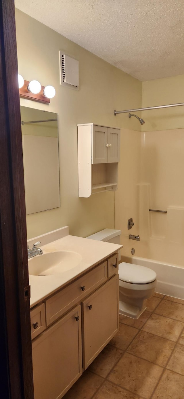 1855 Silver Bell Rd Unit 301, Eagan, MN 55122 - bathroom featuring vanity, a textured ceiling, and tub / shower combination