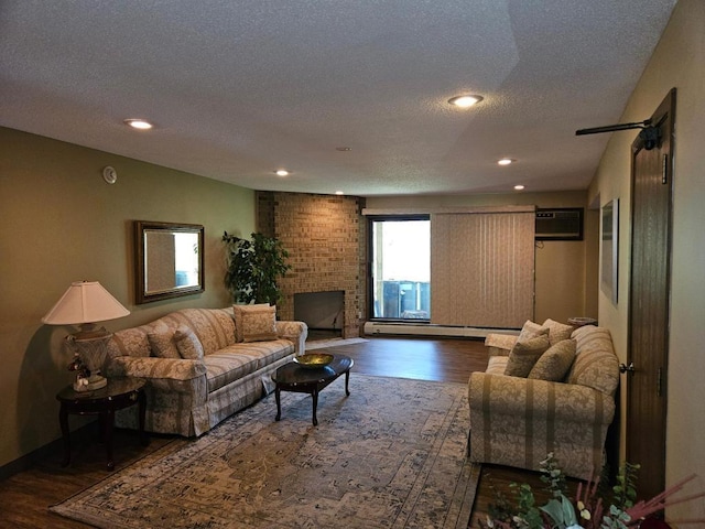 1855 Silver Bell Rd Unit 301, Eagan, MN 55122 - living room with wood finished floors, a textured ceiling, baseboard heating, recessed lighting, and a brick fireplace