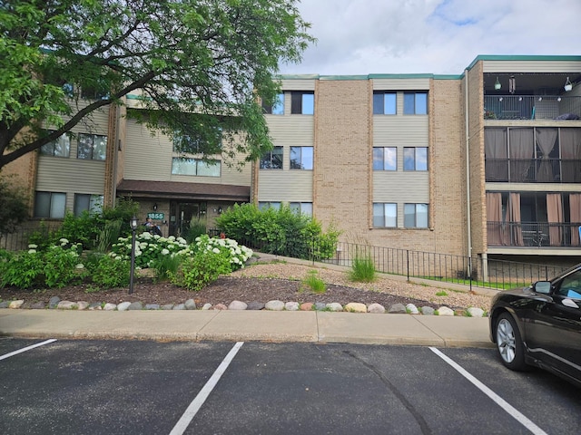 1855 Silver Bell Rd Unit 301, Eagan, MN 55122 - view of building exterior featuring uncovered parking