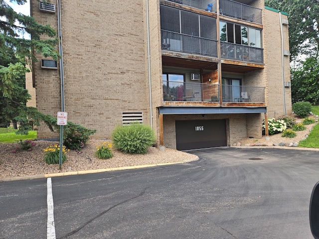 1855 Silver Bell Rd Unit 301, Eagan, MN 55122 - view of building exterior with a garage and driveway