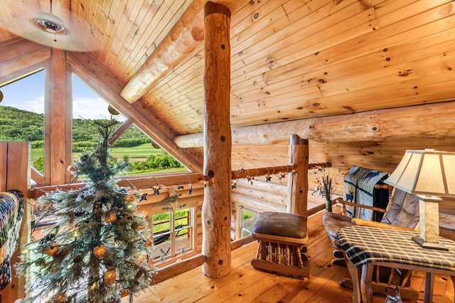 30453 County Road 19, Wiscoy Twp, MN 55971 - living area with log walls, hardwood / wood-style flooring, and wooden ceiling