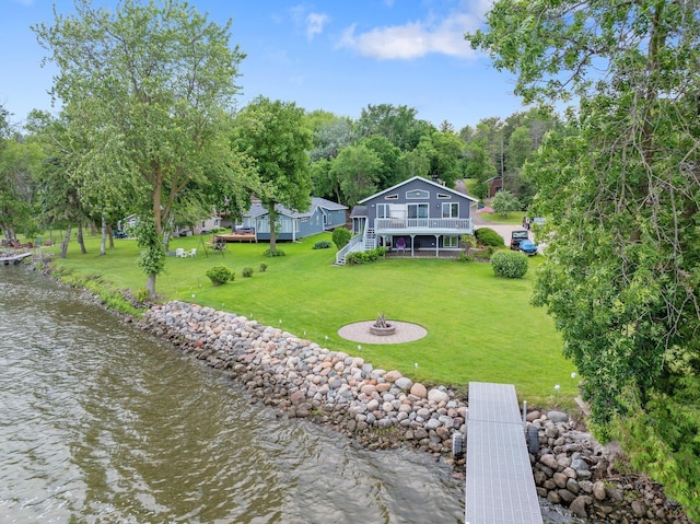 50945 Almond Ave, Nessel Twp, MN 55080 - back of house with a deck with water view, stairs, a yard, and a fire pit