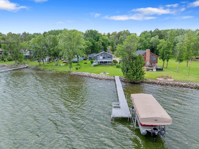 50945 Almond Ave, Nessel Twp, MN 55080 - dock with a water view, a lawn, and an outdoor fire pit