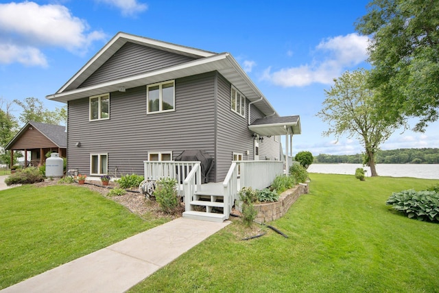 50945 Almond Ave, Nessel Twp, MN 55080 - view of property exterior with a yard and a deck with water view