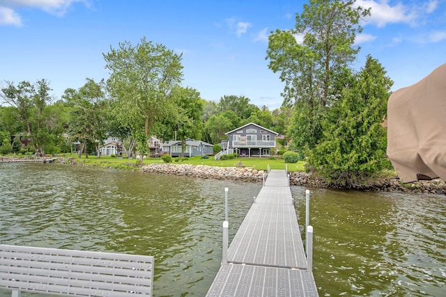 50945 Almond Ave, Nessel Twp, MN 55080 - dock featuring a water view and a lawn