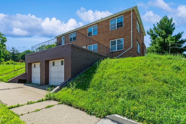 3654 Lyndale Ave N, Minneapolis, MN 55412 - view of side of home featuring a detached garage and brick siding