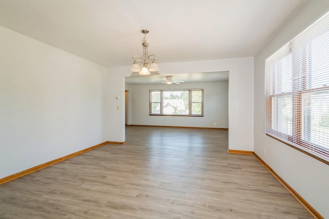 3654 Lyndale Ave N, Minneapolis, MN 55412 - unfurnished room with a chandelier, light wood-type flooring, and a ceiling fan