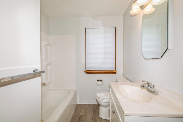 3654 Lyndale Ave N, Minneapolis, MN 55412 - full bathroom featuring wood finished floors, vanity, and washtub / shower combination