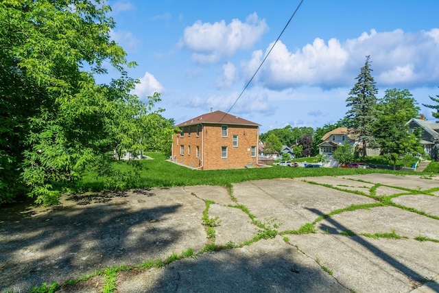 3654 Lyndale Ave N, Minneapolis, MN 55412 - rear view of house featuring brick siding and a yard
