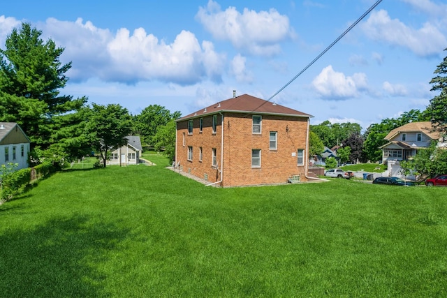 3654 Lyndale Ave N, Minneapolis, MN 55412 - back of property featuring brick siding and a lawn