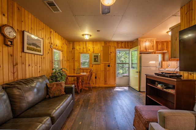 40936 Yost Rd, Emily, MN 56447 - living area featuring dark wood-style floors and wood walls