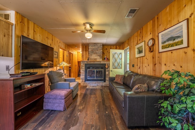 40936 Yost Rd, Emily, MN 56447 - living area with wooden walls, hardwood / wood-style flooring, a ceiling fan, and a fireplace