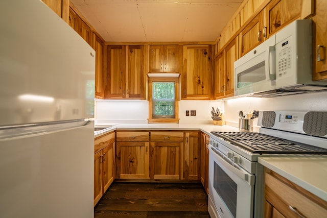 40936 Yost Rd, Emily, MN 56447 - kitchen featuring white appliances, dark wood-style flooring, light countertops, and brown cabinets