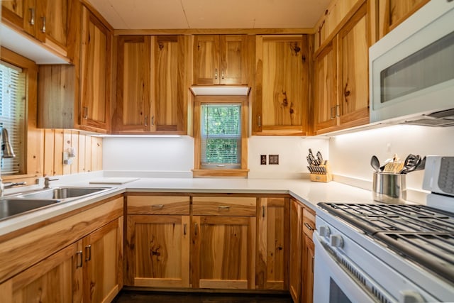 40936 Yost Rd, Emily, MN 56447 - kitchen with white appliances, light countertops, and brown cabinets